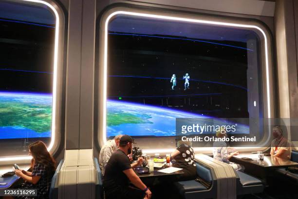 Guests dine at Space 220, the space-themed restaurant at Epcot, at Walt Disney World in Lake Buena Vista, Florida, on Sept. 29, 2021. The immersive...