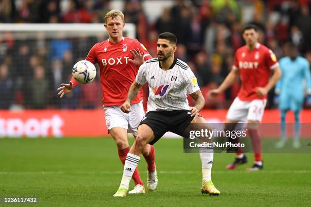 Aleksandar Mitrovic of Fulham and Joe Worrall of Nottingham Forest during the Sky Bet Championship match between Nottingham Forest and Fulham at the...