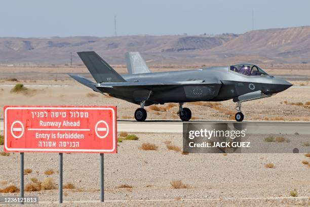 An Israeli air force F-35 fighter lands during the "Blue Flag" multinational air defence exercise at the Ovda air force base, north of the Israeli...