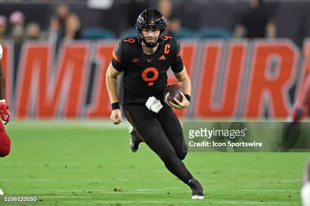Miami quarterback Tyler Van Dyke carries the ball in the first quarter as the University of Miami Hurricanes faced the North Carolina State...