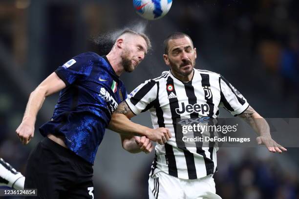 Milan Skriniar of FC Internazionale and Leonardo Bonucci of Juventus FC battle for the ball during the Serie A match between FC Internazionale and...