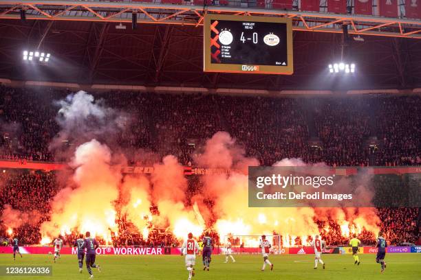 Supporters of Ajax Amsterdam with pyrotechnics during the Dutch Eredivisie match between Ajax and PSV Eindhoven at Johan Cruijff Arena on October 24,...