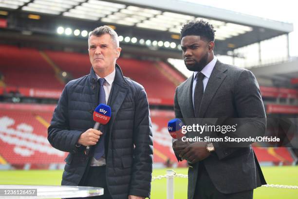 Sky Sports television pundits Roy Keane and Micah Richards look on before the Premier League match between Liverpool and Manchester City at Anfield...