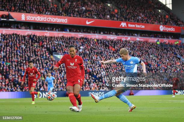 Kevin de Bruyne of Manchester City shoots past Virgil van Dijk of Liverpool during the Premier League match between Liverpool and Manchester City at...