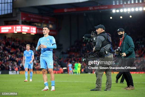 Television Steadicam cameraman stands by as Phil Foden of Manchester City looks on after the Premier League match between Liverpool and Manchester...