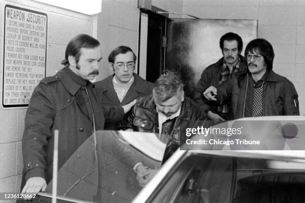 John Wayne Gacy is removed from the Des Plaines Police Station en route to a hospital on Dec. 23, 1978.