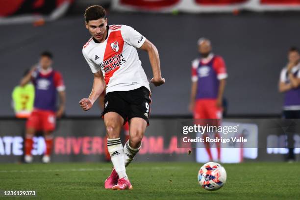 Julian Alvarez of River Plate kicks the ball to score the second goal of his team during a match between River Plate and Argentinos Juniors as part...