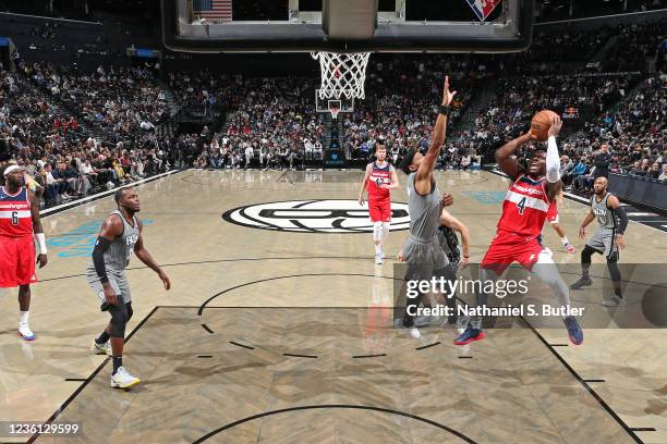 Aaron Holiday of the Washington Wizards drives to the basket against the Brooklyn Netson October 25, 2021 at Barclays Center in Brooklyn, New York....