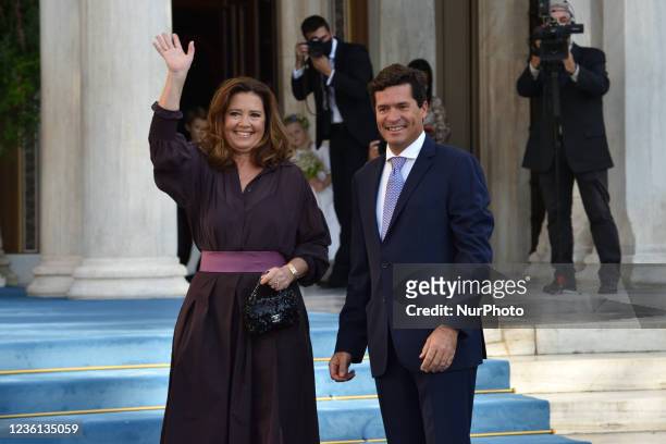 Princess Alexia and Carlos Morales Quintana arrive at the Metropolitan Cathedral of Athens for the wedding of Prince Philippos with Nina Flohr.