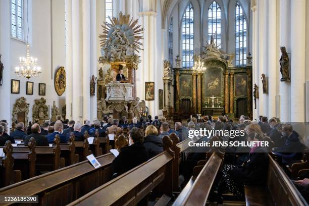 Martin Dutzmann from the Evanglical Church in Germany speaks from the pulpit as members of the outgoing government and delegates listen during an...