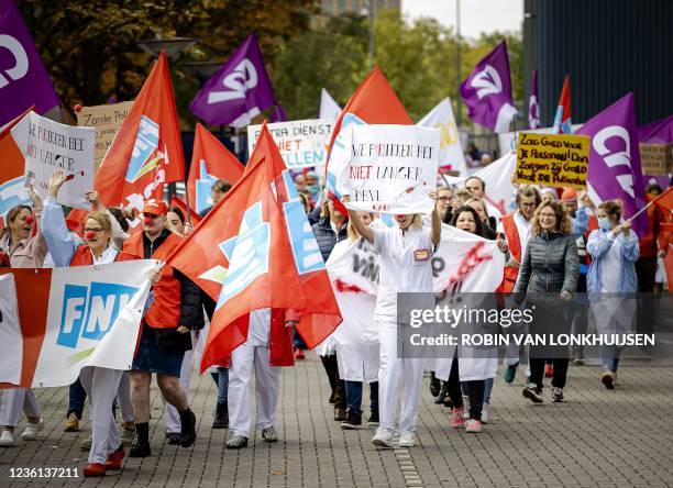 Striking healthcare workers demonstrate for better working conditions at the Leiden University Medical Center on October 26, 2021. - Employees...