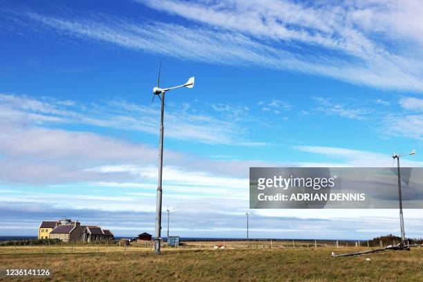 Small wind turbine is pictured on North Ronaldsay, Orkney on September 7, 2021. - North Ronaldsay is the northernmost island in the Orkney...