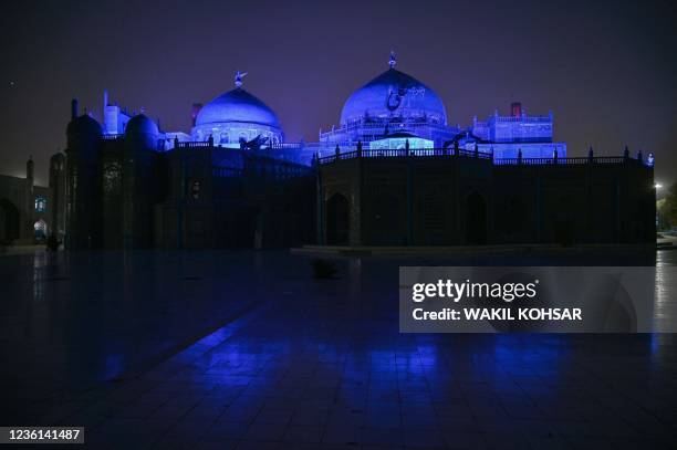 The Hazrat-e-Ali shrine or Blue Mosque, is pictured as it is illuminated, in Mazar-i-Sharif on October 26, 2021.