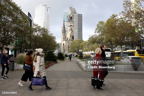 Pedestrians pass the Kaiser Wilhelm memorial church on Kurfuerstendamm in central Berlin, Germany, on Tuesday, Oct. 26, 2021. German business...