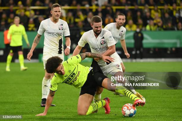 Dortmund's Belgian midfielder Axel Witsel and Ingostadt's Marc Stendera vie for the ball during the German Cup 2nd round football match Borussia...