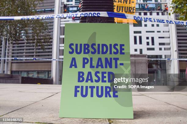 Subsidise a Plant-Based Future' placard is seen during the demonstration. Animal Rebellion activists scaled the Home Office building in Westminster,...