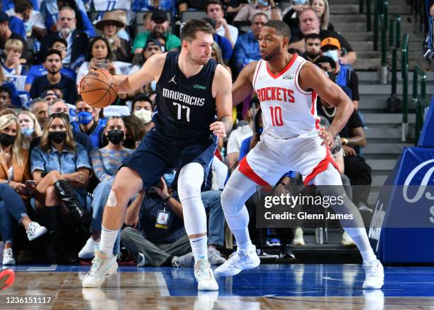 Luka Doncic of the Dallas Mavericks posts up against Eric Gordon of the Houston Rockets on October 26, 2021 at the American Airlines Center in...