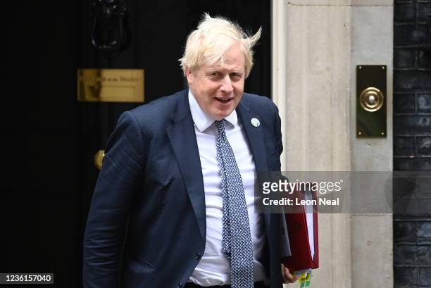British Prime Minister Boris Johnson leaves 10 Downing Street to attend Prime Minister's Questions at the House of Commons, ahead of the presentation...