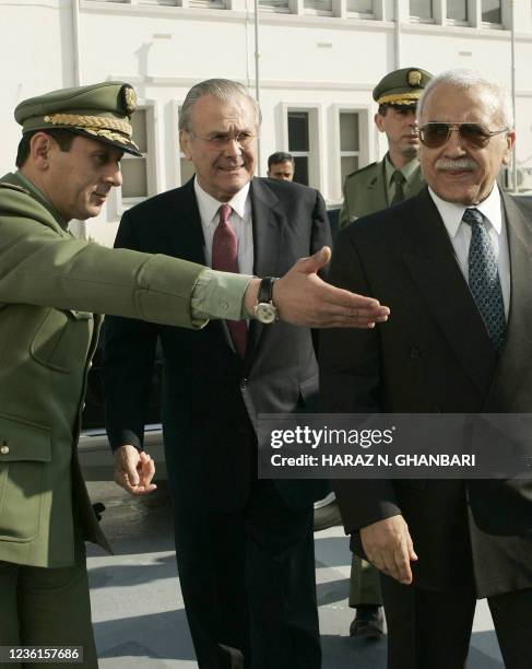 Secretary of Defense Donald Rumsfeld and his Algerian counterpart Abdelmalek Guenaizia prepare to take part in a military ceremony at the Defense...