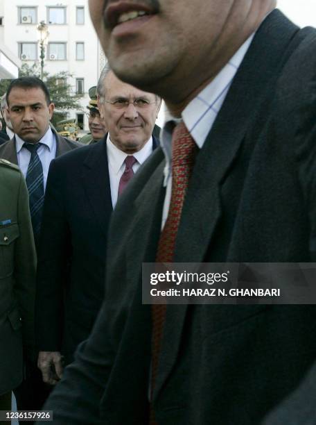 Secretary of Defense Donald Rumsfeld arrives for a meeting with his Algerian counterpart Abdelmalek Guenaizia at the Defense Ministry in Algiers 12...