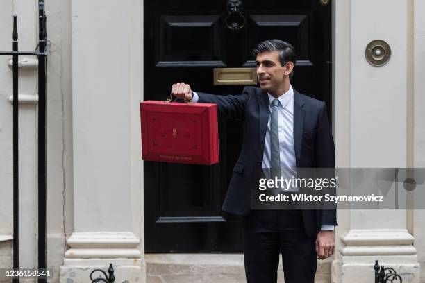 Chancellor of the Exchequer Rishi Sunak holds the Budget box outside 11 Downing Street in central London ahead of the announcement of the Autumn...