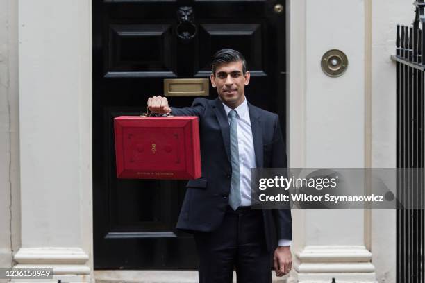 Chancellor of the Exchequer Rishi Sunak holds the Budget box outside 11 Downing Street in central London ahead of the announcement of the Autumn...