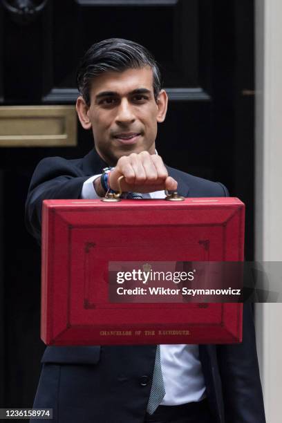 Chancellor of the Exchequer Rishi Sunak holds the Budget box outside 11 Downing Street in central London ahead of the announcement of the Autumn...