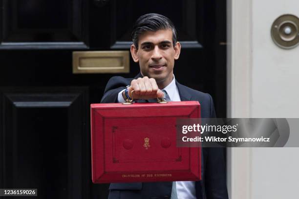 Chancellor of the Exchequer Rishi Sunak holds the Budget box outside 11 Downing Street in central London ahead of the announcement of the Autumn...