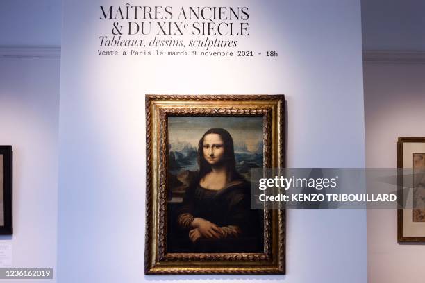 This photograph taken on October 27, 2021 shows a copy of Leonardo da Vinci's Mona Lisa painted around 1600 presented at auction house Artcurial in...