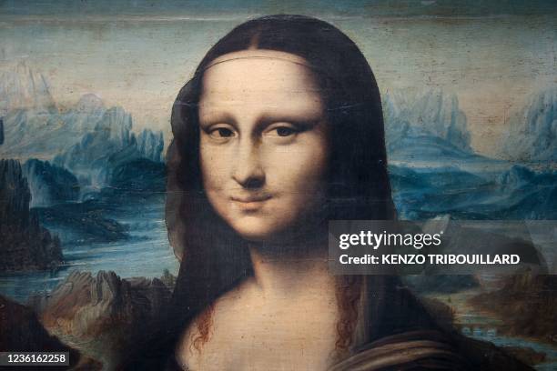 This photograph taken on October 27, 2021 shows a copy of Leonardo da Vinci's Mona Lisa painted around 1600 presented at auction house Artcurial in...