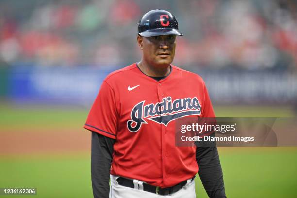 First base coach Sandy Alomar Jr. #15 of the Cleveland Indians walks off the field after the fourth inning against the Cincinnati Reds at Progressive...