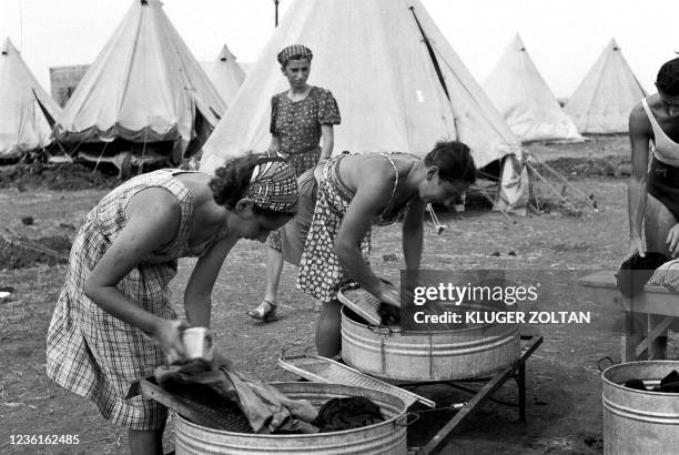 Picture dated 01 March 1940 shows new immigrants wahing their laundry at the immigrants camp near Kibbutz Na'an. On November 29 the United Nations'...