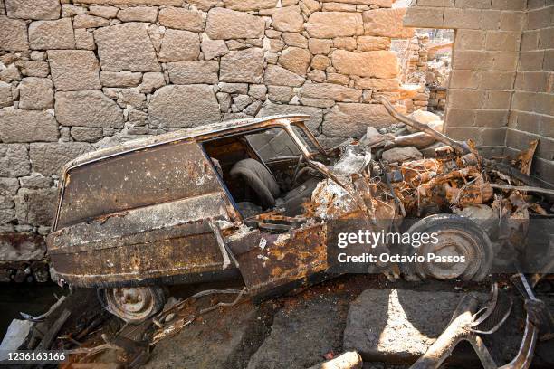 Car is seen near the partly submerged Aceredo village buildings as they emerge from the river Lima on October 27, 2021 in Lobios, Ourense, Spain. The...