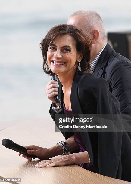 John Paul Gaultier and Ines de la Fressange are interviewed for Chanel+ program 'Le Grand Journal' at Majestic Beach Pier on May 12, 2011 in Cannes,...