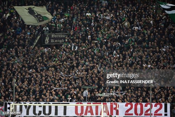 Banner calling for the boycott of the 2022 Qatar World Cup is on display during the German Cup 2nd round football match Borussia Moenchengladbach v...