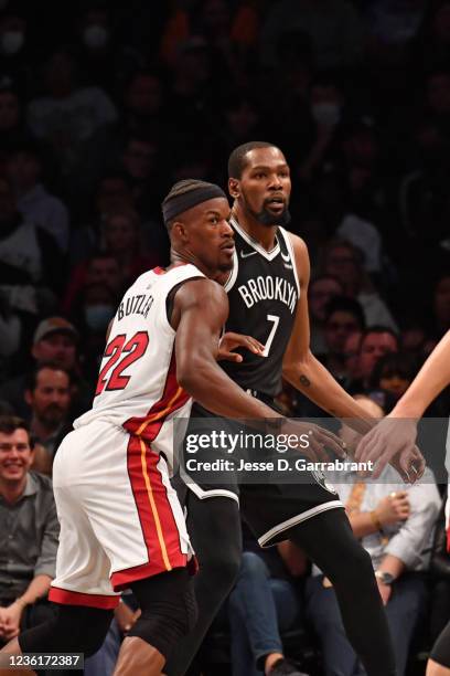 Jimmy Butler of the Miami Heat plays defense against Kevin Durant of the Brooklyn Nets on October 27, 2021 at Barclays Center in Brooklyn, New York....