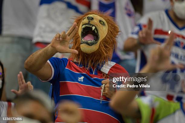 Fan of Fortaleza wearing a lion mask gestures before a match between Fortaleza and Atletico MG as part of Copa do Brasil Semi-Finals 2021 at Castelao...