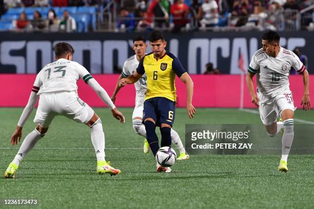 Ecuador's defender Christian Cruz vies for the ball with Mexico's defender Haret Ortega , foward Uriel Antuna and defender Jose David Ramirez during...