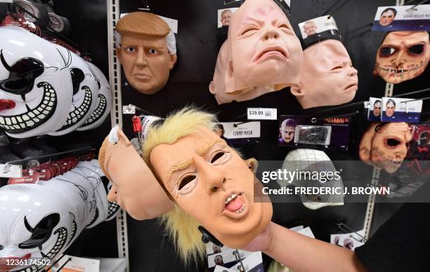 Donald Trump mask is seen among other Halloween masks as people shop for Halloween products on October 27, 2021 in Alhambra, California, ahead of...