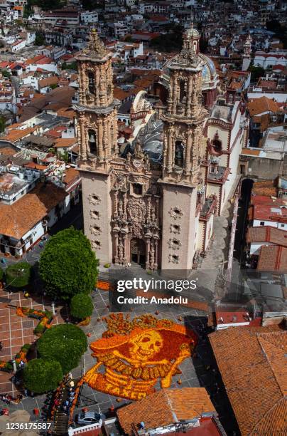 An aerial view of the figure of a Catrina skull made with 18,000 Cempasuchil flowers is on display at the Church of Santa Prisca as part of Day of...