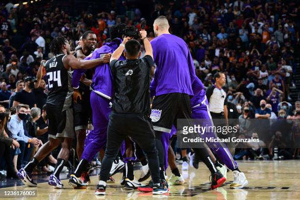 Harrison Barnes of the Sacramento Kings reacts with his teammates after making the game winning shot against the Phoenix Suns on OCTOBER 27, 2021 at...