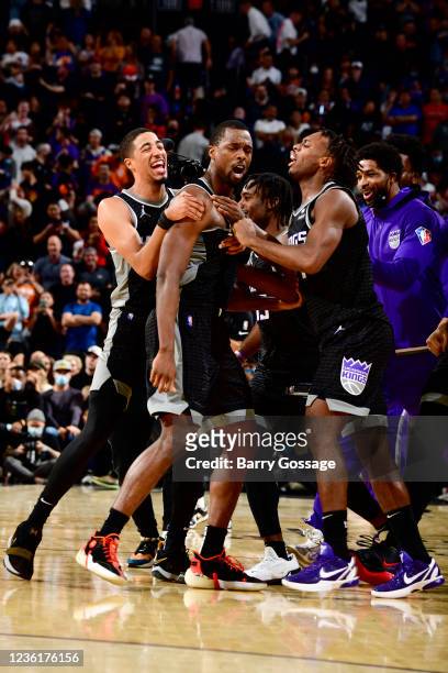 The Sacramento Kings celebrate Harrison Barnes of the Sacramento Kings shooting a three point basket at the buzer to win the game against the Phoenix...