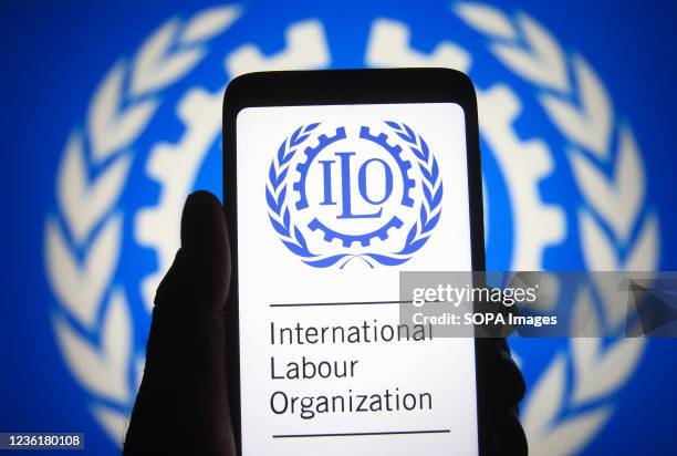 In this photo illustration, International Labour Organization logo seen displayed on a smartphone.