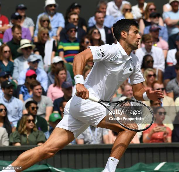 Novak Djokovic of Serbia moves across the court during his men's Singles Final match against Matteo Berrettini of Italy on Day Thirteen of The...