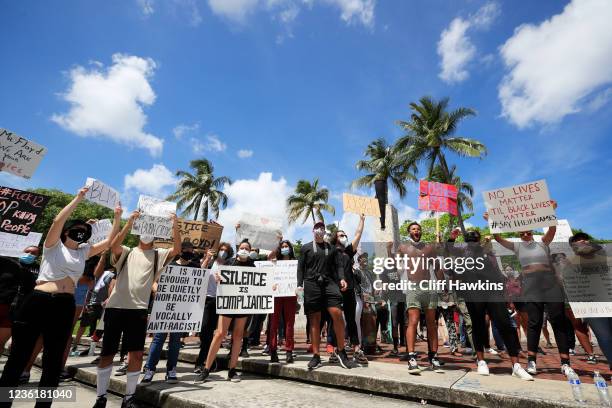 Activists hold a rally in response to the recent death of George Floyd at the Torch of Friendship in Bayfront Park on May 30, 2020 in Miami, Florida....