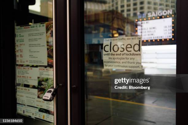 Sign reads "Due to slow traffic, we will be closed' outside a restaurant in the Pioneer Square district of Seattle, Washington, U.S., on Friday, Oct....