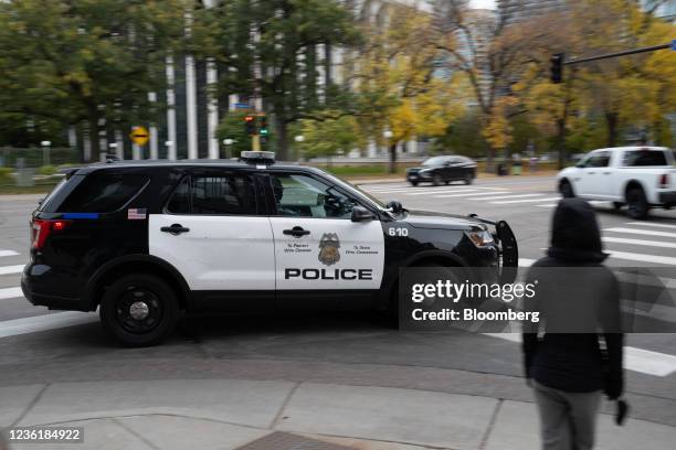 Police vehicle travels in downtown in Minneapolis, Minnesota in Minneapolis, Minnesota, U.S., on Sunday, Oct. 24, 2021. More than a year after George...