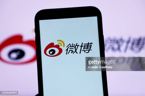 Mobile phone displays the "bomb comment" function of Sina Weibo in Shenzhen, South China's Guangdong Province, Oct. 28, 2021. After the user clicks...