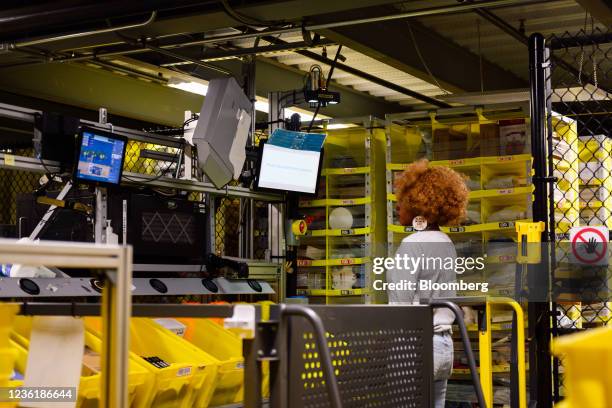 Worker prepares orders for shipment at the Amazon.com BFI4 fulfillment center in Kent, Washington, U.S., on Thursday, Aug. 5, 2021. August 4, 2021....