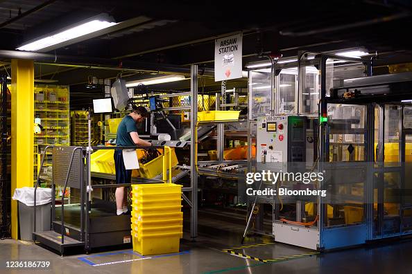 Amazon Operating Machine Workers at the Amazon Robotics Semi-Automatic Workstation at the ...